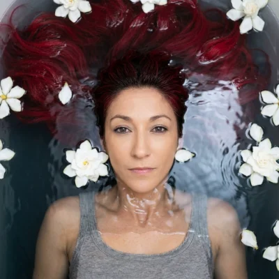 Floating in Dark Water with Petals